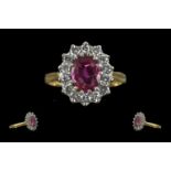 Ladies 18ct Gold Pleasing Ruby and Diamond Set Ring. Marked 750 - 18ct to Interior of Shank. Ruby of