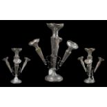 A Silver Eperne, hallmarked for Chester of typical form with three trumpet vases. Loaded base.