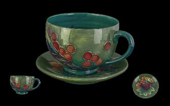 Moorcroft Tubelined 'Birds and Berries' Design Cup and Saucer. On Green Ground. Both Cup / Saucer In