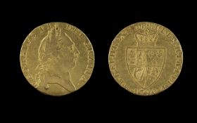 George III Gold Guinea Date 1790. Toned and worn with several scratches on obverse. About Fine.