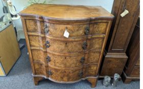 19th Century Walnut Chest of Drawers, shaped front, four graduating drawers, raised on bracket feet.