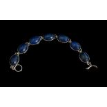 Silver Bracelet Set With Oval Lapis Lazuli Stones.