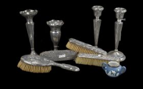 Collection of Nine Items of Hallmarked Silver, comprising a pair of candlesticks 8'' high, two bud