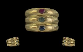 18ct Gold Trilogy Banded Gem Set Ring. Set with Blue Sapphire Emerald and Ruby all of Good Colour.