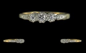 18ct Gold and Platinum 3 Stone Diamond Set Ring, Illusion Set. The Round 3 Faceted Diamond of
