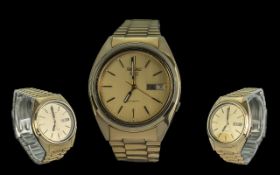 Seiko 5 - Gents Gold on Steel Automatic Wrist Watch. Features Champagne Dial, Day / Date Display