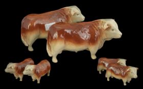 Pair of Brown & White Butchers Window Display Bulls, measures approx. 5'' high x 9'' long.