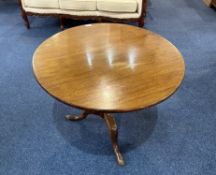 A 19th Century Mahogany Tilt Top Table of circular form, and turned supports on three cabriole legs.