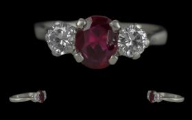 Ladies Pleasing Quality Platinum Three Stone Ruby and Diamond Set Ring, marked for platinum to the