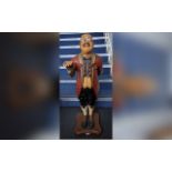 Wooden Butler Statue, holding out his hand for a tip, wearing a tailcoat and glasses. Measures