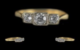 Ladies 18ct Gold and Platinum Petite 3 Stone Diamond Set Ring of Pleasing Design. Marked 18ct and