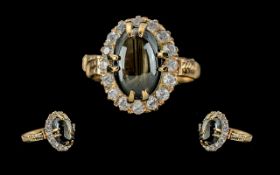 Ladies 18ct Gold Pleasing Quality Diamond and Black Gem Stone Set Ring. The Polished Cabouchon Cut
