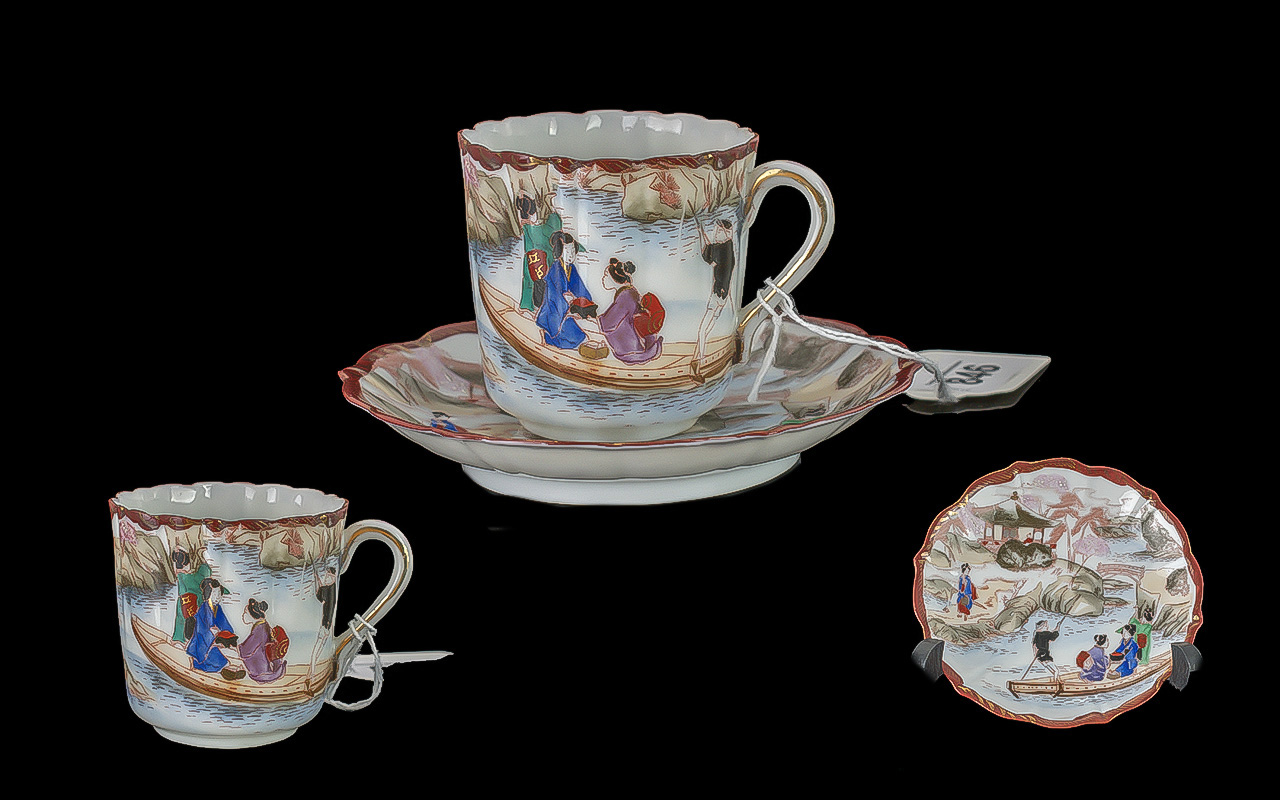 Japanese Cup & Saucer, decorated with figures in a boating scene. Unmarked.
