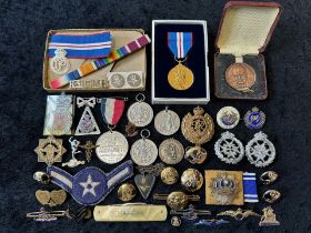 A Collection of Military Items to include pin badges, silver medals, a Churchill medal, pen knife