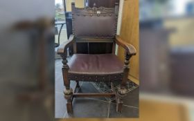 1940's Spanish Oak Carver Chair, with leather seat, studded decoration, carved front legs,