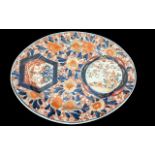 Large Oriental Platter, 13'' wide. Bright orange and blue designs with trees and flowers.