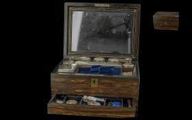 A Victorian Ladies Rosewood Travelling Set the hinged lid with integral mirror containing silver