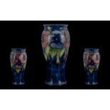 Moorcroft Pleasing Large Tube lined 'Blue Pansy' Vase, circa 1920s, script mark for William