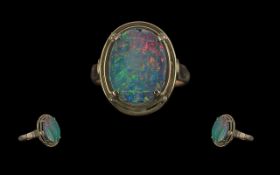 Ladies Attractive 14ct Gold Single Stone Opal Set Ring, marked 14ct to shank, the large, oval