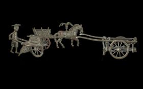 An Italian sterling silver miniature model of a cart, length 9cm, approx 1.2ozt. Plus two other