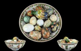 Oriental Style Bowl decorated with figures, flowers and butterflies, filled with assorted onyx and
