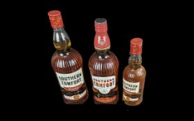 Three Bottles of Southern Comfort, comprising 2 x 1 litre bottles and 1 x 35 cl bottle.