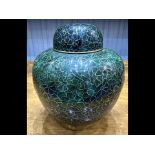 Cloisonne Ginger Jar with lid, in original box with stand. Measures 9'' plus stand. Dark green and