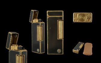 Vintage Dunhill Lighter in leather case, black and gold colourway.