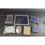 Collection of Silver Picture Frames, comprising 12'' x 9.5'' oblong frame, two matching style frames