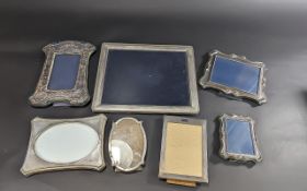 Collection of Silver Picture Frames, comprising 12'' x 9.5'' oblong frame, two matching style frames