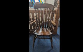 A Solid Elm and Beech Cottage Armchair of large size, spindle and turn support.