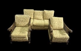 An Early 20thC Three Piece Mahogany Bergere Suite comprising two armchairs and a two seater sofa