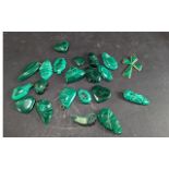 A Collection of Malachite Pendants and Carvings, including a cross, tribal masks, heart shaped, etc.