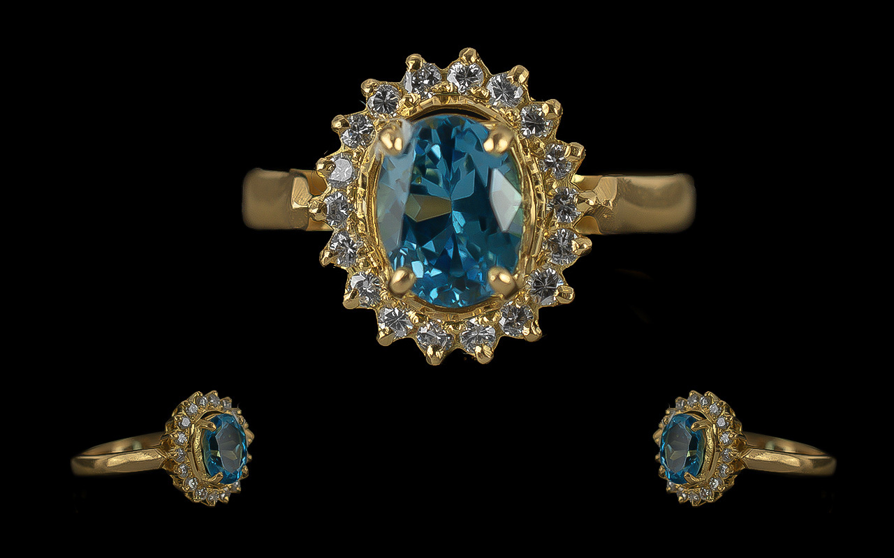 Ladies Fine and attractive 18ct Gold Blue Topaz and Diamond Set Cluster Ring - Marked 750 To Shank.