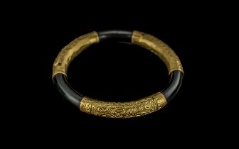 Chinese Early 20th Century 21ct Gold Banded Bangle with embossed naturalistic floral design,