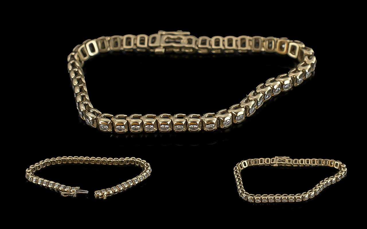 14ct Gold - Attractive Diamond Set Tennis Bracelet. Marked 14ct, Set with Well Matched Diamonds of