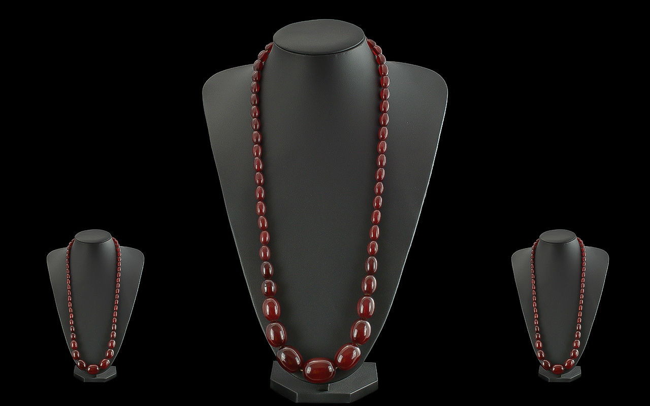 An Early 20th Century Fine Quality Cherry Amber Beaded Graduated Necklace - Of Excellent Colour