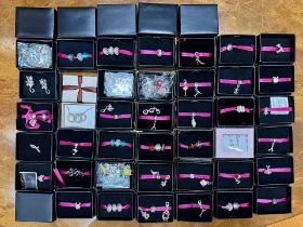 Collection of Boxed Avon 'Treasure Beads', 46 boxed charms, together with some loose, various charms