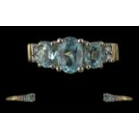 Ladies 14ct Gold Aquamarine and Diamond Set Dress Ring. Marked to Interior of Shank. The Faceted