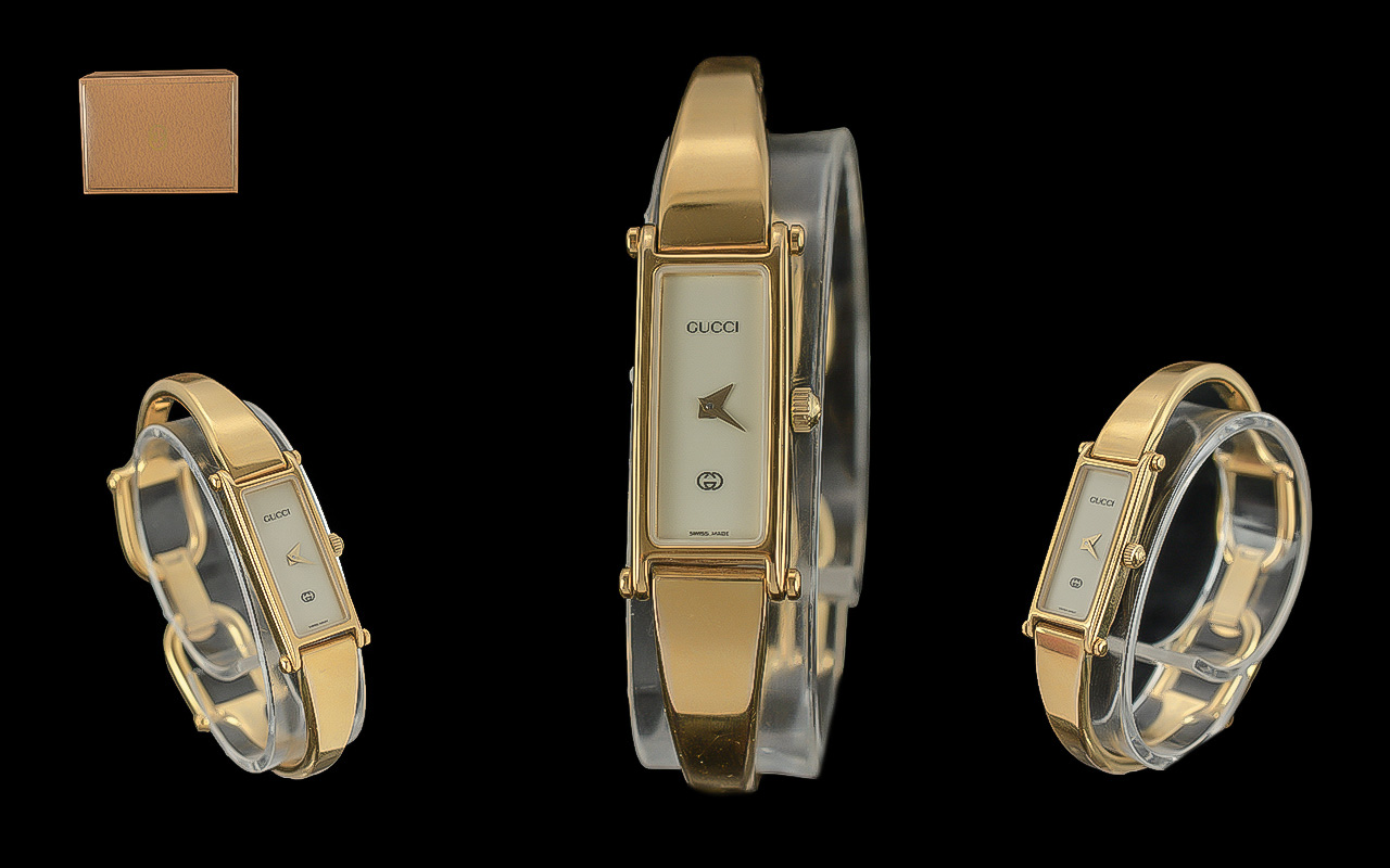 Gucci Ladies Gold Plated - Quartz Bangle Watch. Model No 1500. Signed to Clasp, Dial and Back Cover.