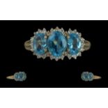 Ladies 9ct Gold Attractive 3 Stone Aquamarine and Diamond Set Ring. Full Hallmark to Interior of