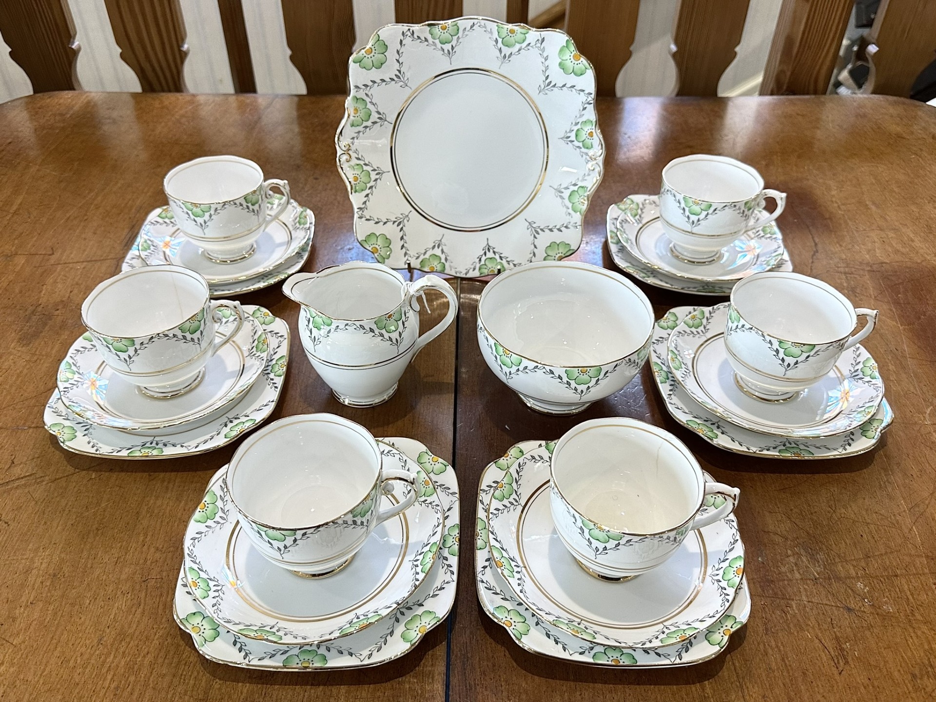 Roslyn Bone China Tea Service 'Fantasy', comprises six trios of cup, saucer and side plate, bread