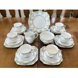 Roslyn Bone China Tea Service 'Fantasy', comprises six trios of cup, saucer and side plate, bread