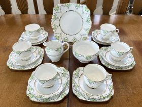 Roslyn Bone China Tea Service 'Fantasy', comprises six trios of cup, saucer and side plate, bread