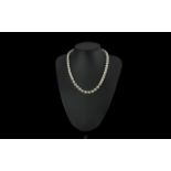 Single Strand Pearl Necklace with 9ct gold clasp, bottom ten pearls with gold spacers between.