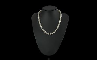 Single Strand Pearl Necklace with 9ct gold clasp, bottom ten pearls with gold spacers between.