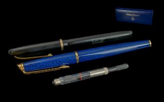 Two Waterman Pens with one original box. One in mottle blue design with gold tone nib and One with