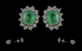 Ladies 14ct White Gold Pair of Emerald and Diamond Set Earrings. Marked 14ct - 585. The Emeralds and
