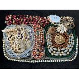 A Collection of Vintage Costume Jewellery to include necklaces, pearls, brooches, gold tone