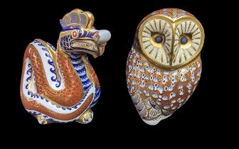 Two Royal Crown Derby Paperweights, comprising a Dragon and an Owl. Both with gold stoppers.